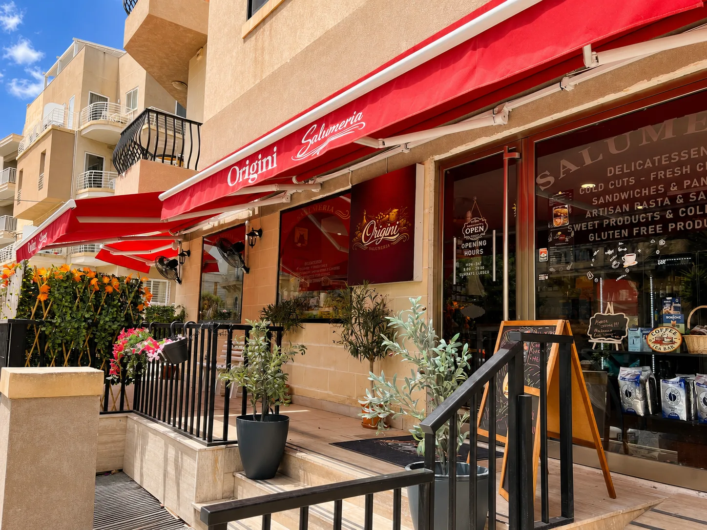 Origini Salumeria shopfront with red awning on Triq Is-Swieqi, Malta